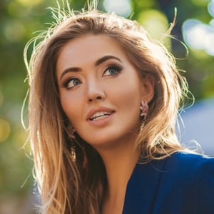 attractive-woman-dressed-in-blue-elegant-suit-sitt-2026-03-10-01-06-00-utc-1